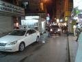 Cars squeeze thru the crowded streets of the Souk