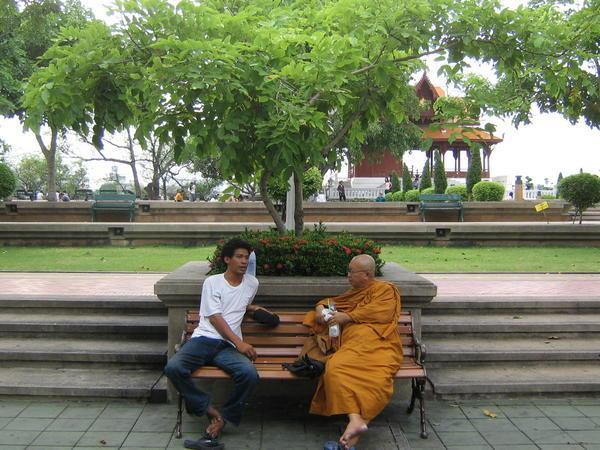 Thai monk, sharing some words of wisdom I imagine