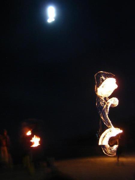 Man plays with fire at full moon party