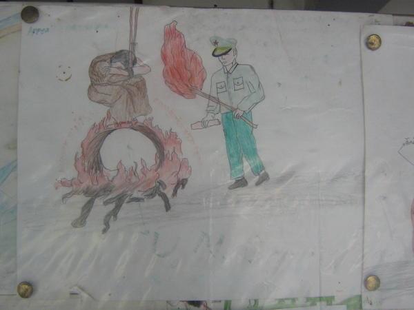 Reception centre- Picture drawn by a child showing a tibetan monk being burnt alive by a chinese soldier