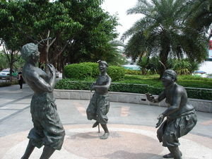 Statues on waterfront promenade