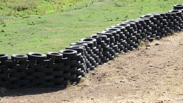 using old tires to fence cattle