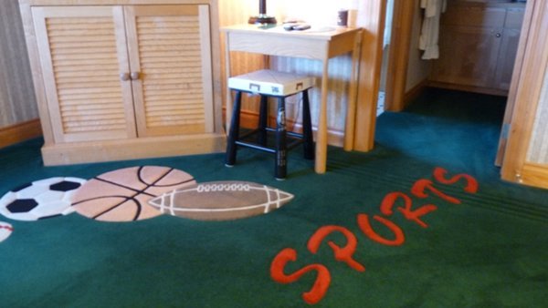 with a sports theme in my room (note the legs on the table and stool)