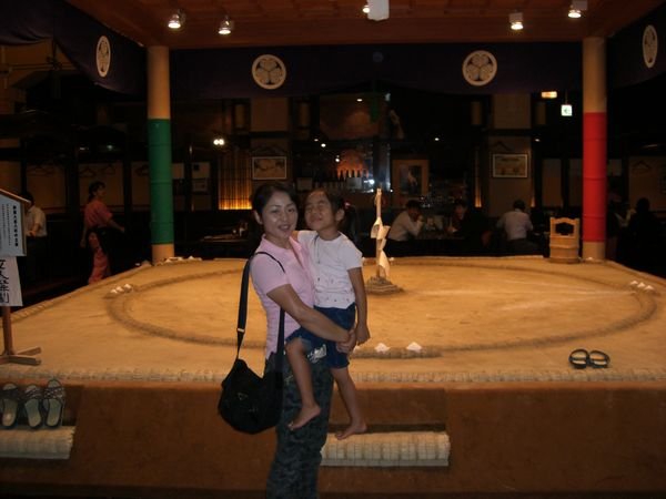 Yuka and Karen in front of a sumo ring