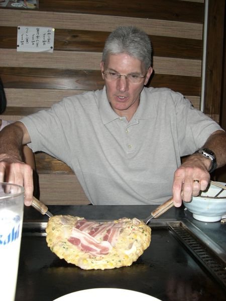 My dad flipping his Okonomiyaki