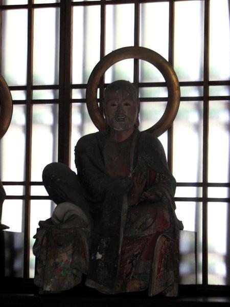 Figure inside a shrine