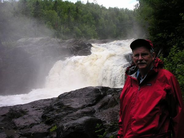 Bob beside one of the many waterfalls we saw.