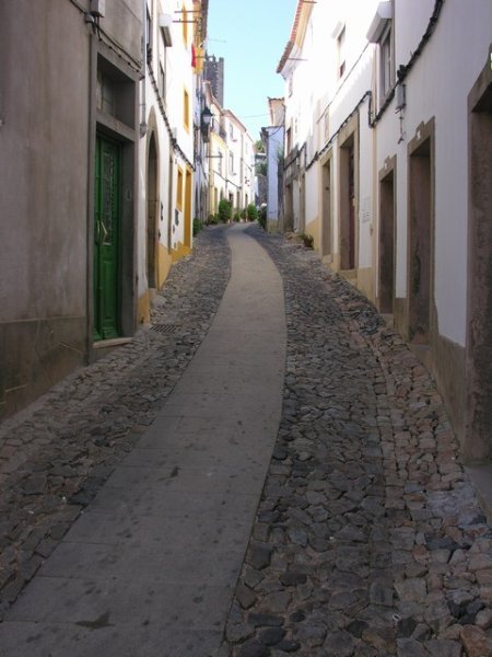 The narrow street leading down to the plaza, and yes it has traffic,