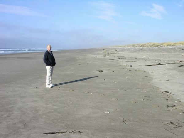 Kel walking along the Pacific in Brandon OR