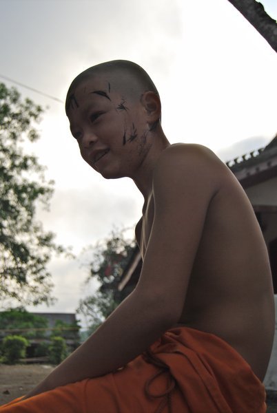 Novice after having his head shaved to enter the monkhood. 