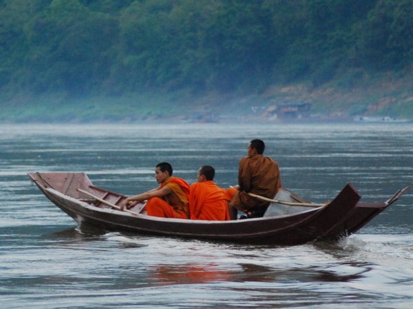 Monks and novices travelling by boat. They are not allowed to travel by bicycle in town. 