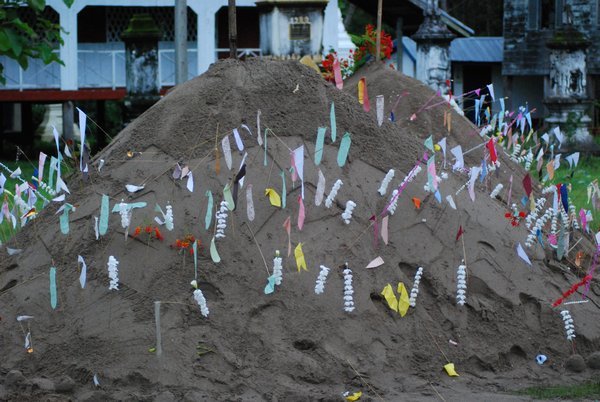 Handmade Dirt Piles with Money Sticks for Big Buddha Day