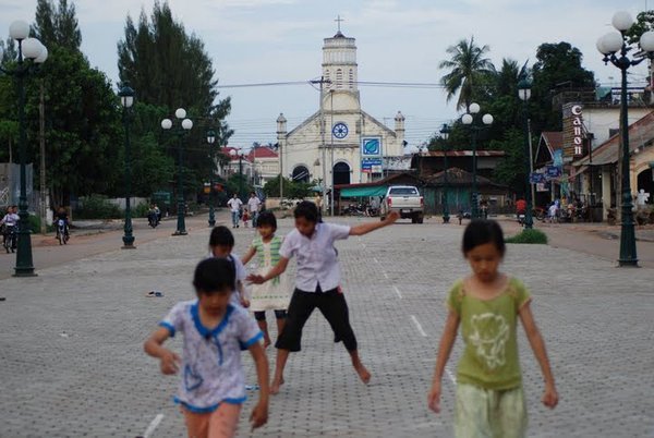 Kids Playing Soccer on a Grand Old Boulevard