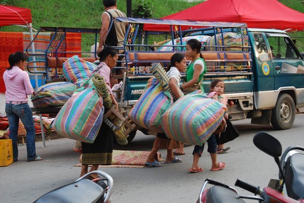 Carrying Bags of Crafts to Market