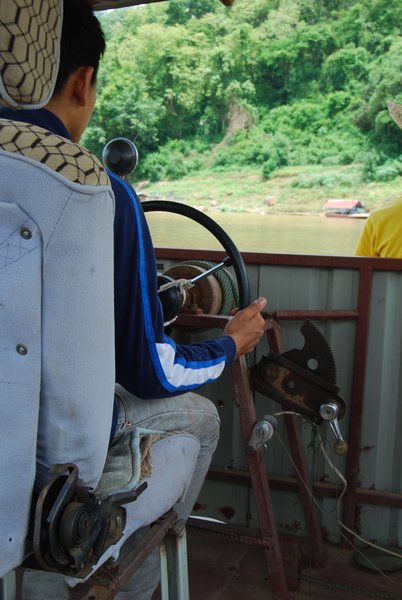 Driving the Ferry Across the Mekong
