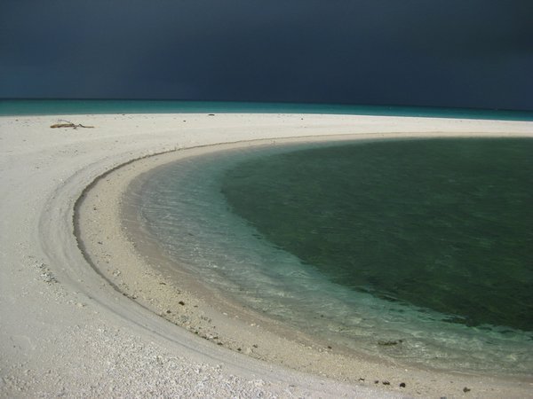 White sand beach  with c shaped  sand bar