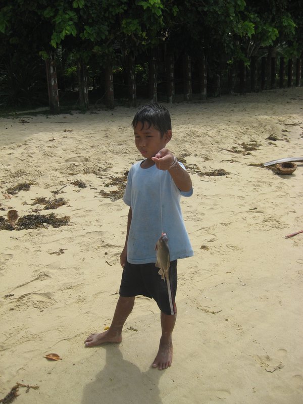 kid showing his catch