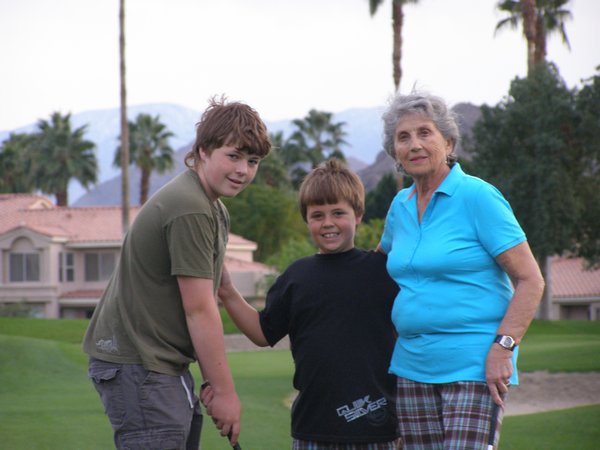 Alex, Gabriel and mom on the golf course