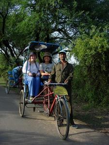 On a bicycle Rickshaw.