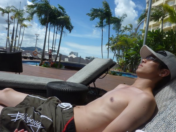 Suntanning at our hotel's pool