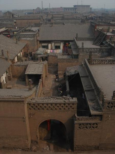 view into one of the houses in pingyao from the wall