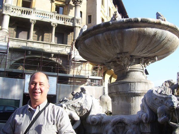Dad in front of the frog fountain