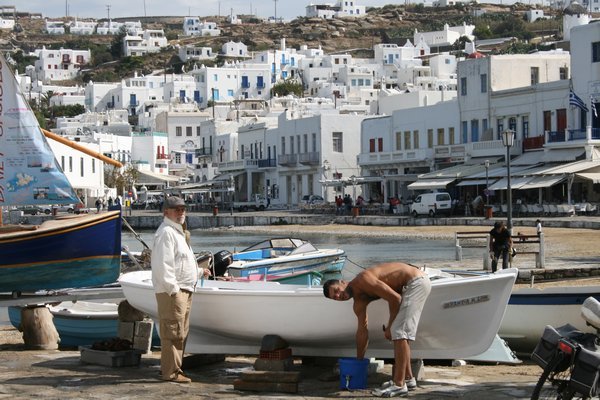 Greek boy washing boat