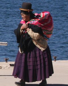 Bolivian lady on the lake shore