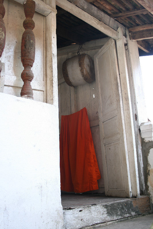 Monk's saffron robe and drum, Luang Prabang, Lao PDR