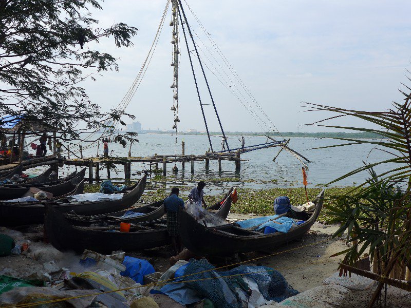 Chinese fishing nets, with hand made boats in foreground