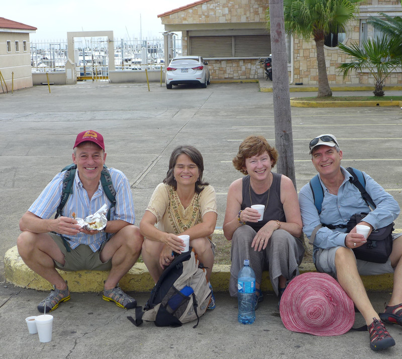 Travel buddies having an empanada breakfast