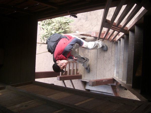 Mike climbing the stairs to get into our homestay