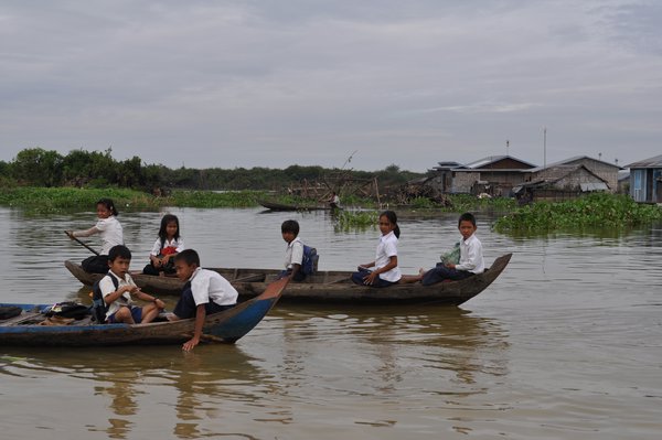 Children paddling to school