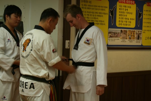 Mike getting his black belt! Chuka-hamnida! Congrats!