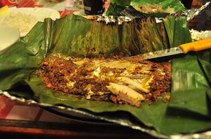Delicious Fish cooked in banana leaf and coffee