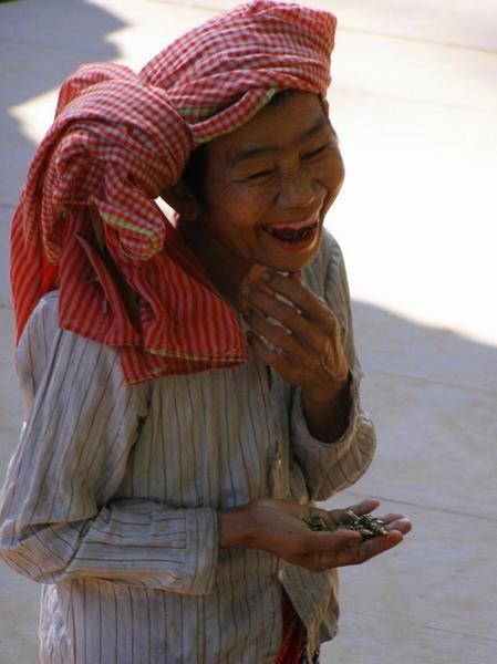 A Cambodian Lady Selling Brass
