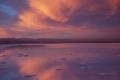 Amazing sunset and its reflection in salt lagoon