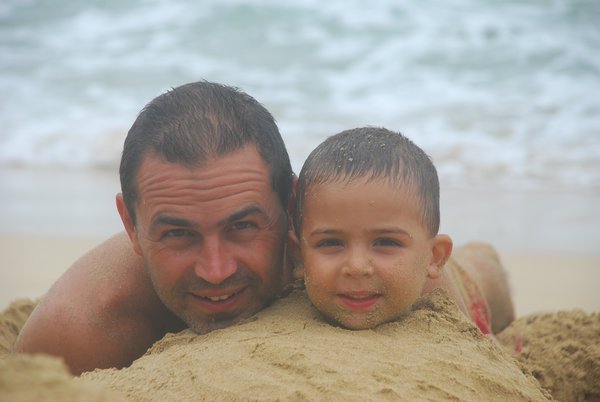 Shachar and my dad playing in the sand