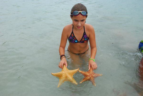 Holding two starfish