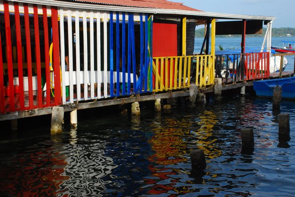A colorful building above the water