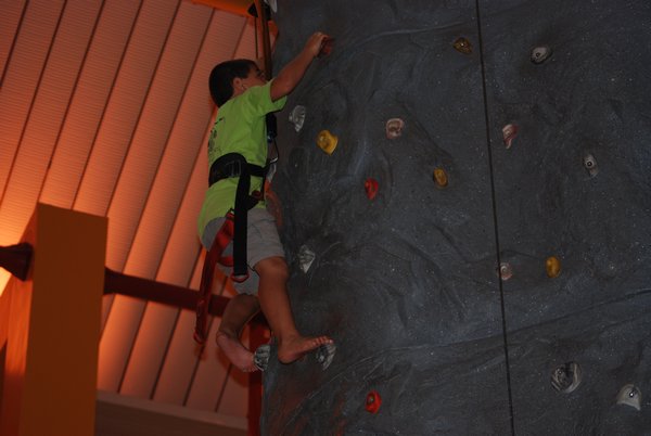 Omer climbing a wall