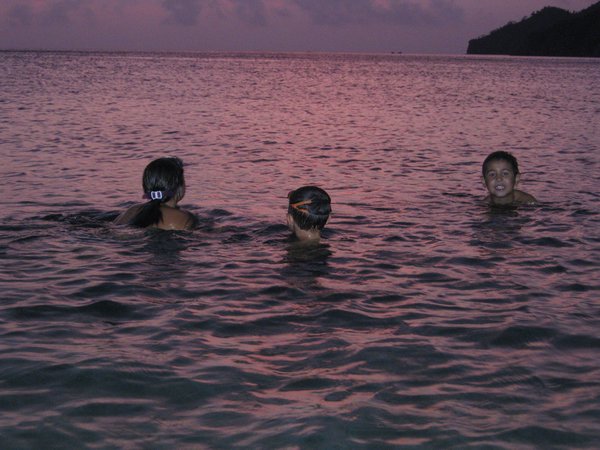 Our 3 kids in the purple sea (sunset effect)