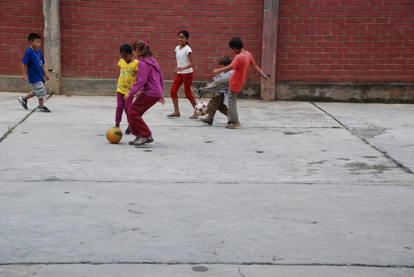 Playing football with the local kids