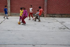 Playing football with the local kids