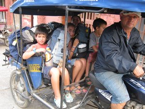 We and our bags on a mototaxi - its slightly crowded...