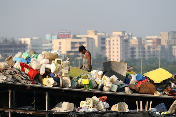 Recycling with city in background