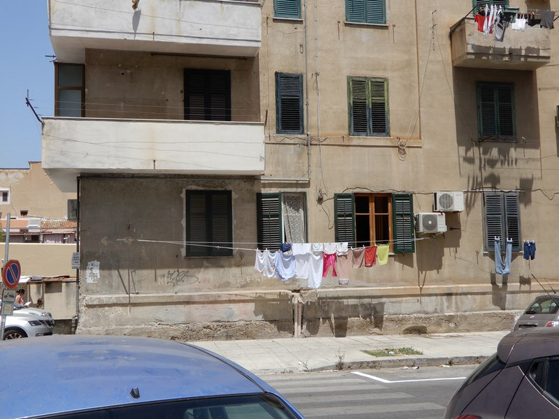 Dry Clothes Where There is Space, Even Over Sidewalks