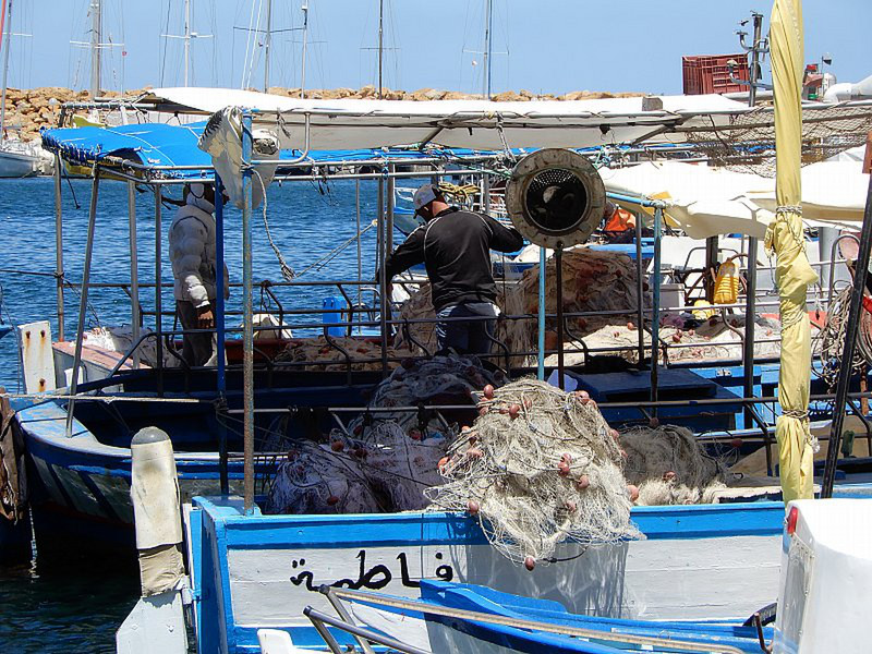 Fishermen Working on Their Nets