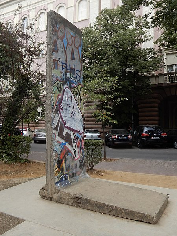 Part of the Berlin Wall Stands Close to A Bunker