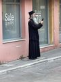 What is This Greek Orthodox Priest Taking Photo Of?